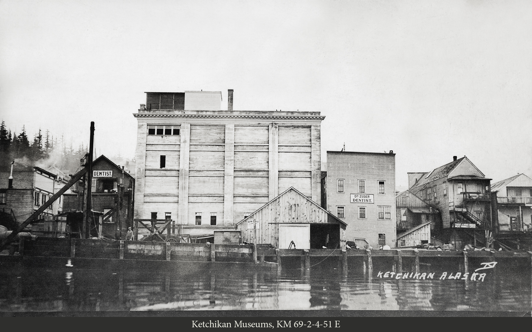 Waterfront view of Cold Storage, Dr. Zuber's Dentist Office, and the Hunt Building, 1914